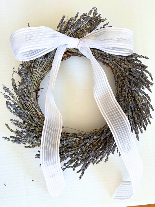 Round lavender wreath with wide striped white ribbon